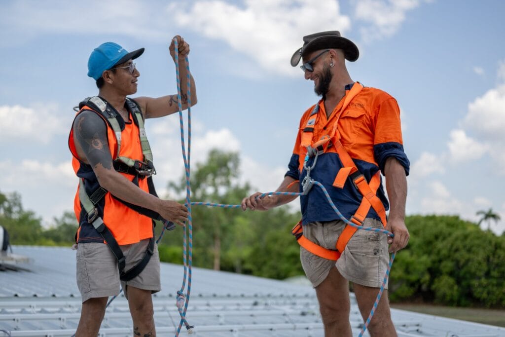EcoTechSolarInstallPhotos_WILDFOTO-13 Eco Tech Electrical team members working with ropes during a rooftop solar installation in Darwin, NT.