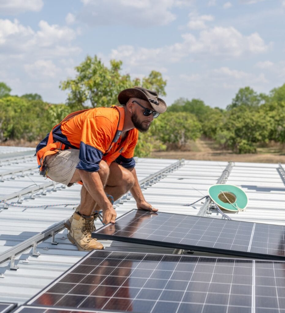 EcoTechSolarInstallPhotos_WILDFOTO-20 Eco Tech Electrical worker installing solar panels on a rooftop in Darwin, NT